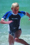 Boy running out of the surf